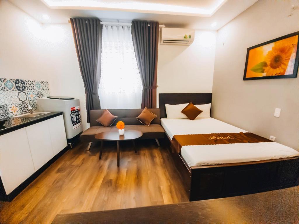 Postel nebo postele na pokoji v ubytování King Hotel Da Nang