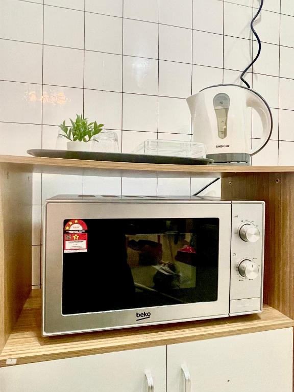 Kuchyň nebo kuchyňský kout v ubytování The D Carlton HomeStay 2BR