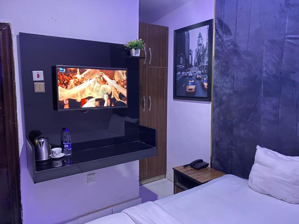 Postel nebo postele na pokoji v ubytování Palazzo Apartments