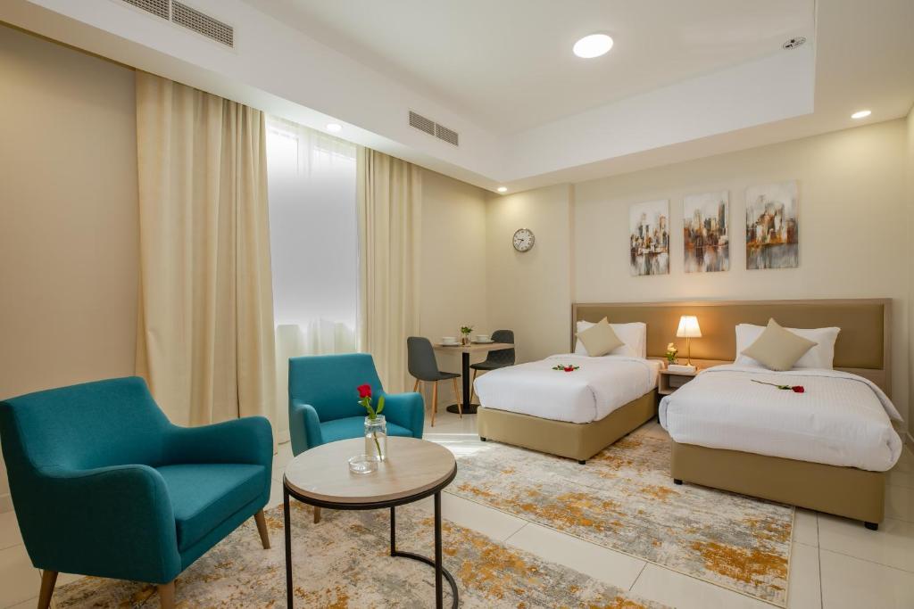Postel nebo postele na pokoji v ubytování Platinum Coast Hotel Apartments