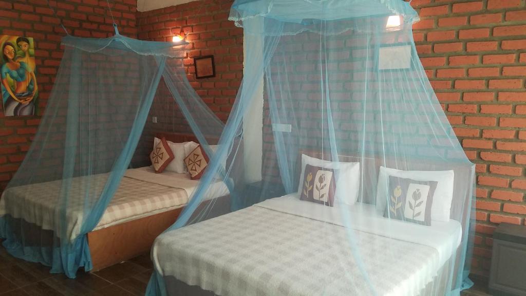 Postel nebo postele na pokoji v ubytování Ayubo Ella - Bed & Breakfast
