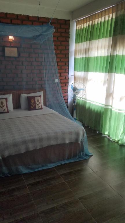 Postel nebo postele na pokoji v ubytování Ayubo Ella - Bed & Breakfast