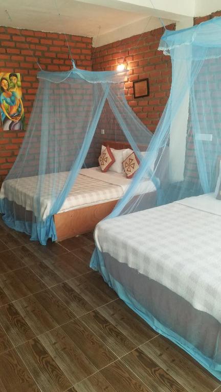Postel nebo postele na pokoji v ubytování Ayubo Ella - Bed & Breakfast