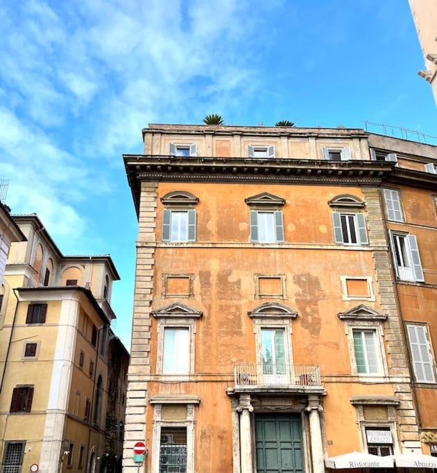 a tall brick building with windows on the side of it at Aphrodite Apartment Piazza Venezia in Rome