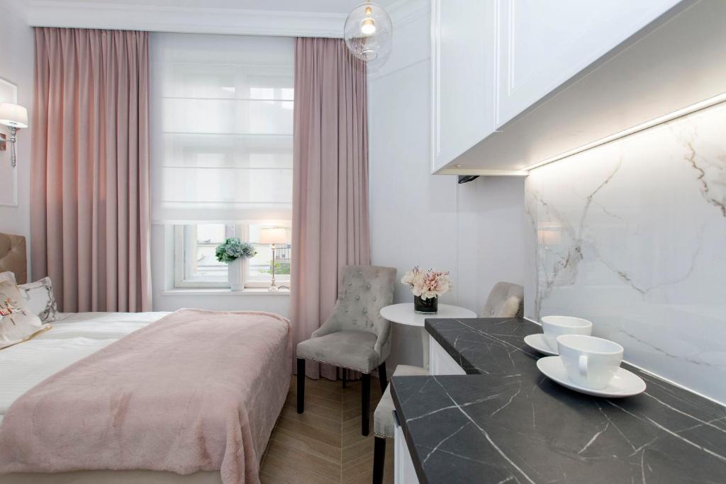 Posteľ alebo postele v izbe v ubytovaní La Boutique Studio Sopot