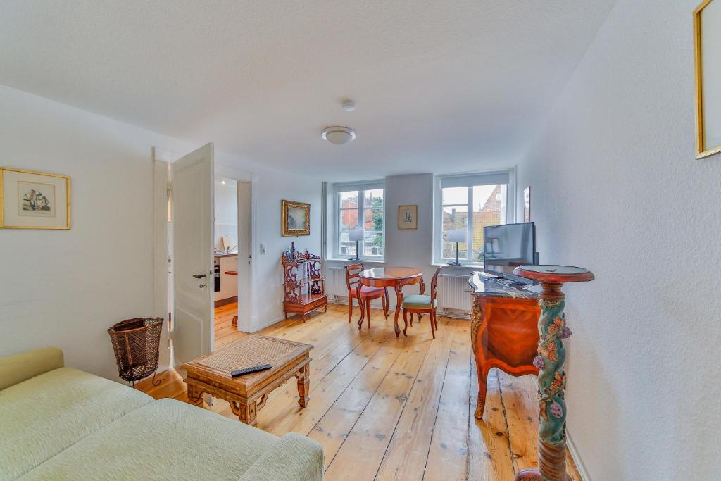 a living room with a couch and a table at Apartments Friederike - Therese - Ida in Lübeck