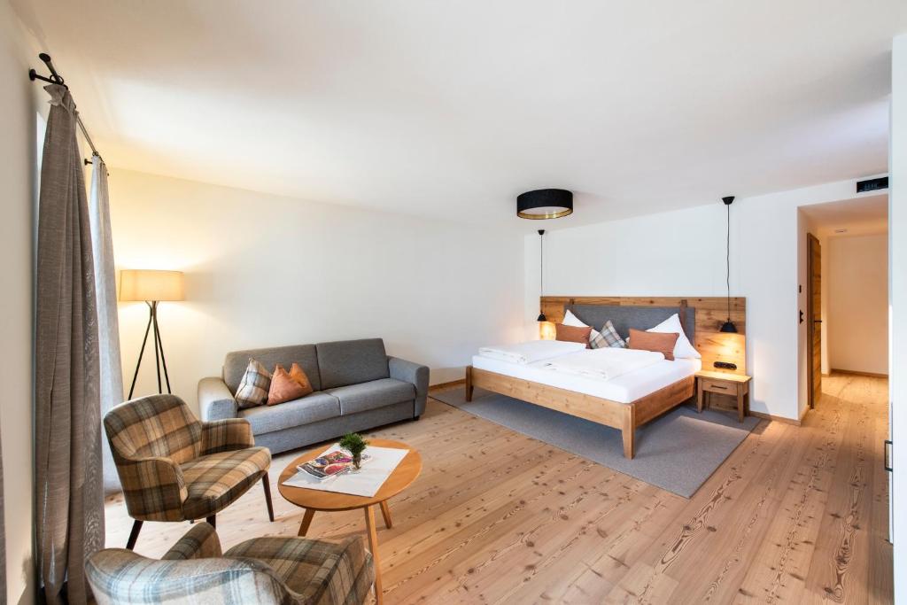 Postel nebo postele na pokoji v ubytování Hotel Grünerhof