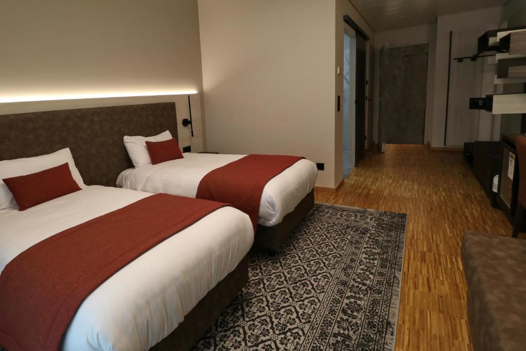 Postel nebo postele na pokoji v ubytování Threeland Hotel