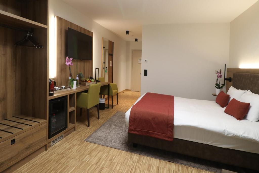 Postel nebo postele na pokoji v ubytování Threeland Hotel