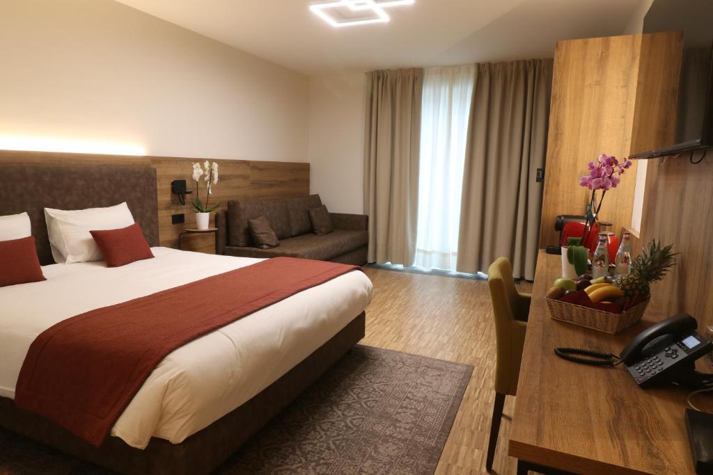 Postel nebo postele na pokoji v ubytování Threeland Hotel