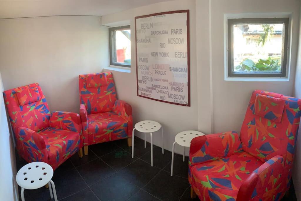 a waiting room with two chairs and two tables at Omakotitalo, Raisio (near Meyer gate) in Raisio