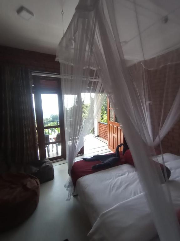 Postel nebo postele na pokoji v ubytování adam's apple homestay