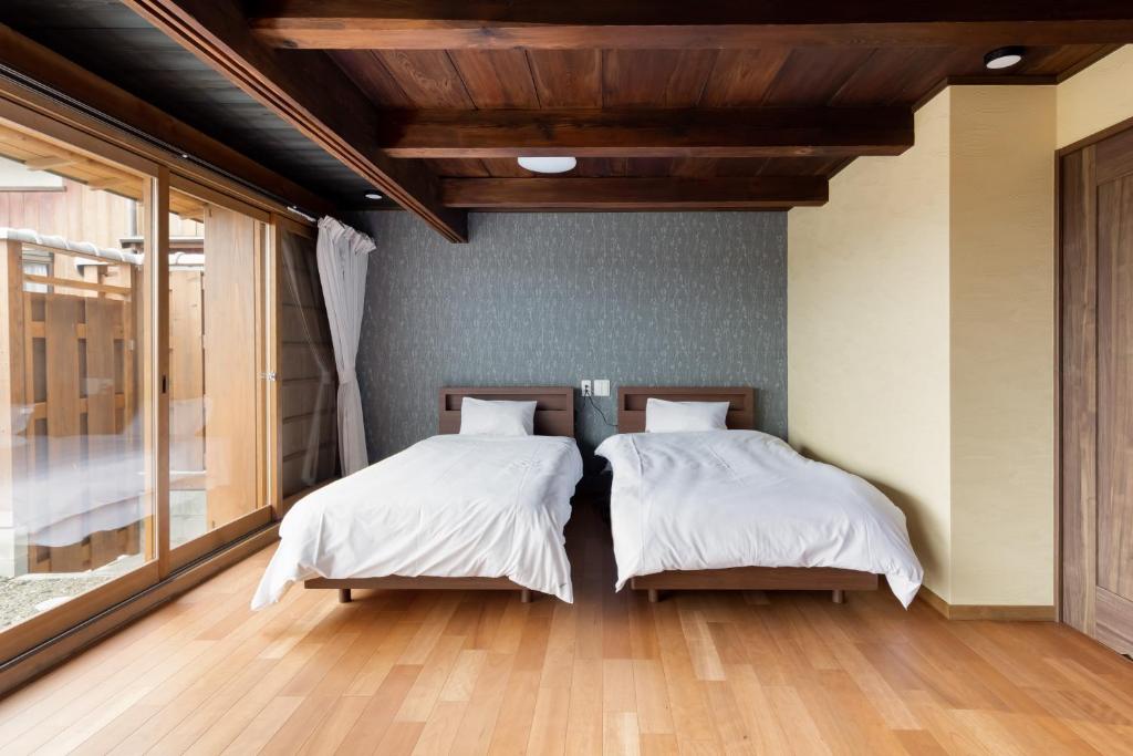Letto o letti in una camera di Satsuki (60min to koya, KIX)