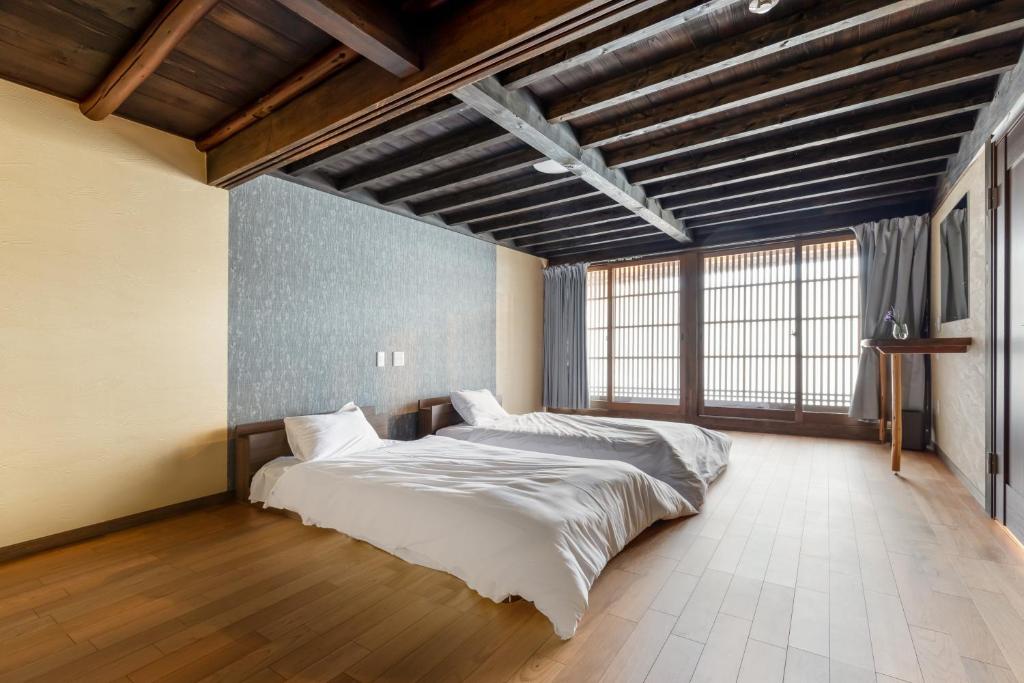 Letto o letti in una camera di Satsuki (60min to koya, KIX)