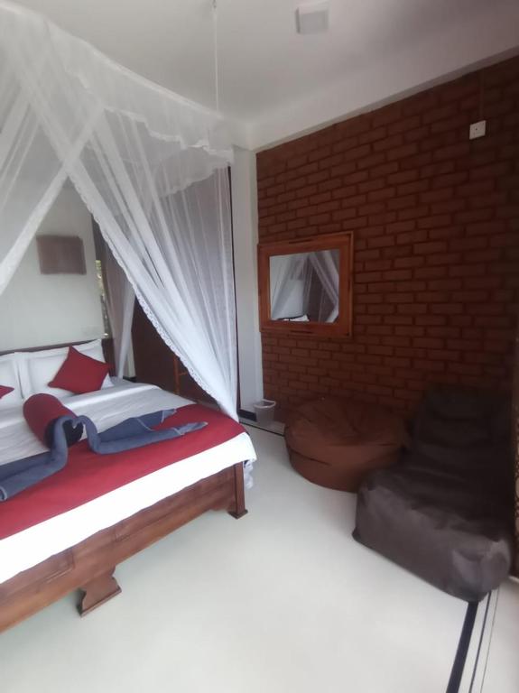 Postel nebo postele na pokoji v ubytování adam's apple homestay