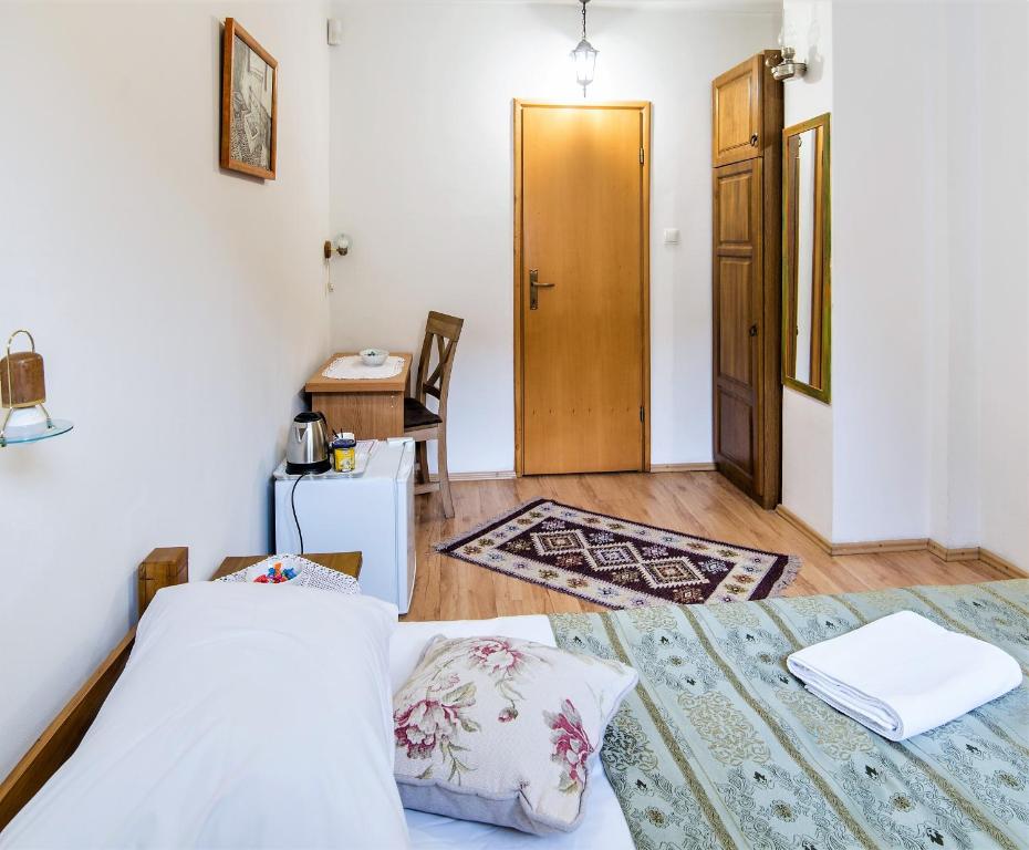 Postel nebo postele na pokoji v ubytování Hotel Kandilj