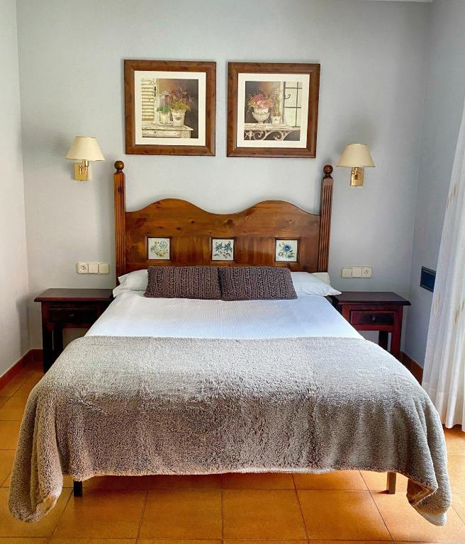 Postel nebo postele na pokoji v ubytování Hotel Ostau d'Òc