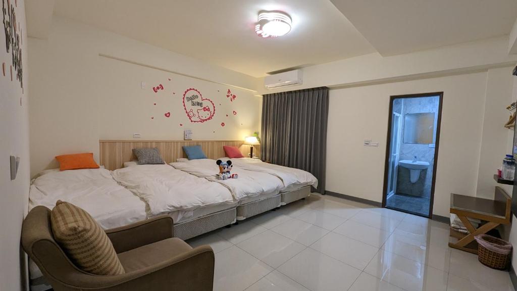 Postel nebo postele na pokoji v ubytování 礁溪幸福民宿Jiaoxi Happy Homestay