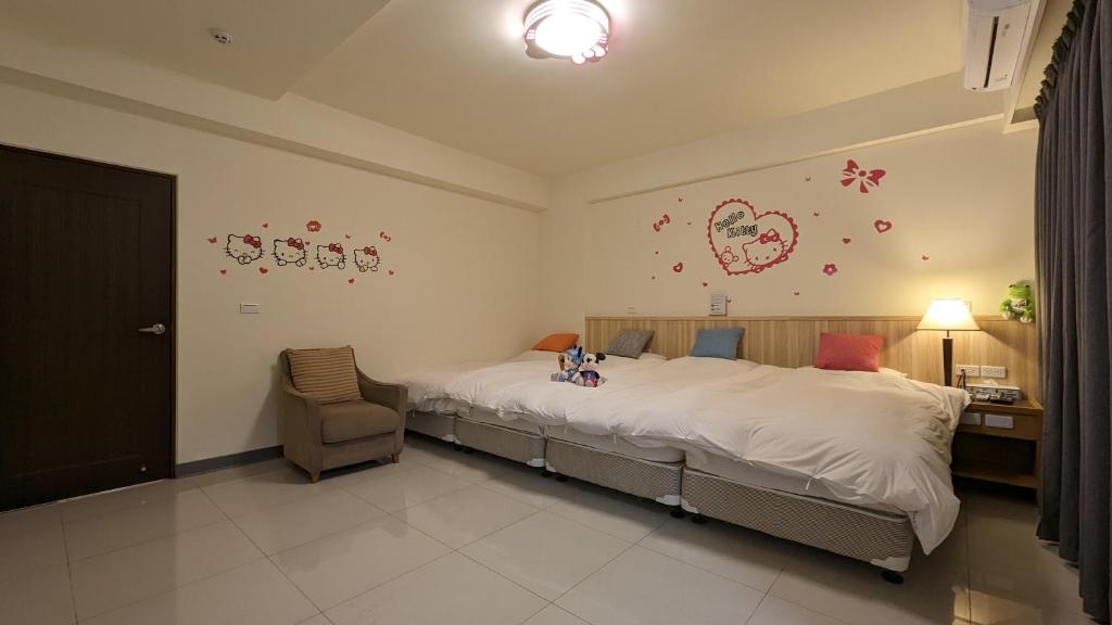Postel nebo postele na pokoji v ubytování 礁溪幸福民宿Jiaoxi Happy Homestay