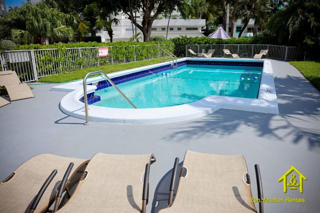 The swimming pool at or close to BH Club by Zen Vacation Rentals 2BR 1BA