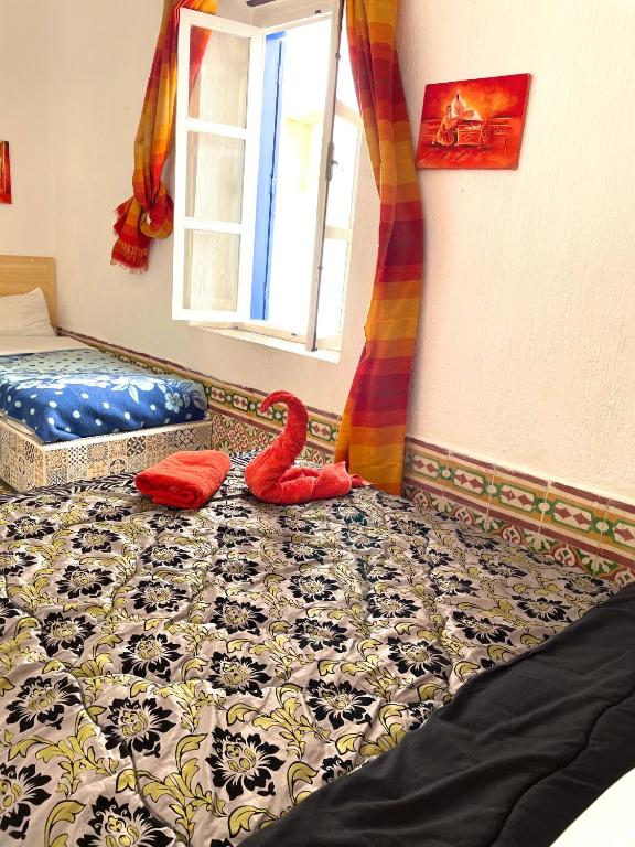 Postel nebo postele na pokoji v ubytování Riad chez brahim