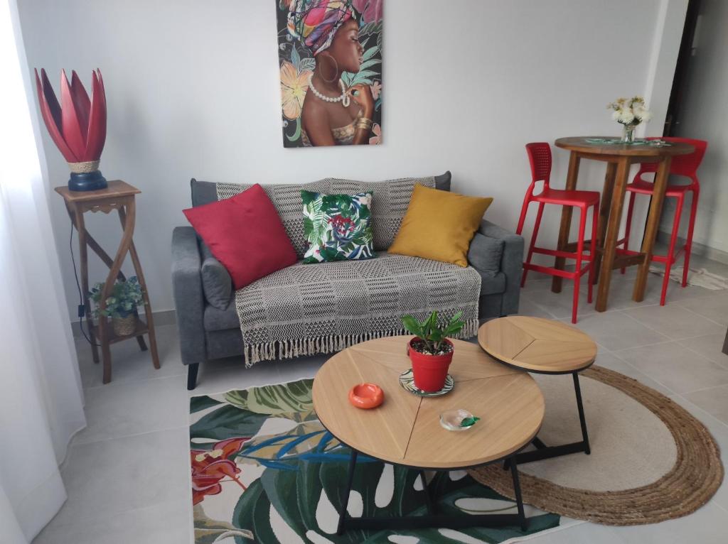 a living room with a couch and a table at Shoumy in Les Trois-Îlets