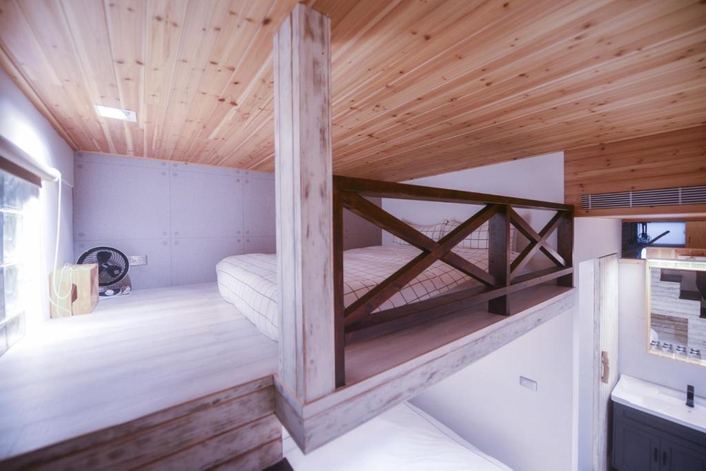 Postel nebo postele na pokoji v ubytování CASA CoMoDo 自在家