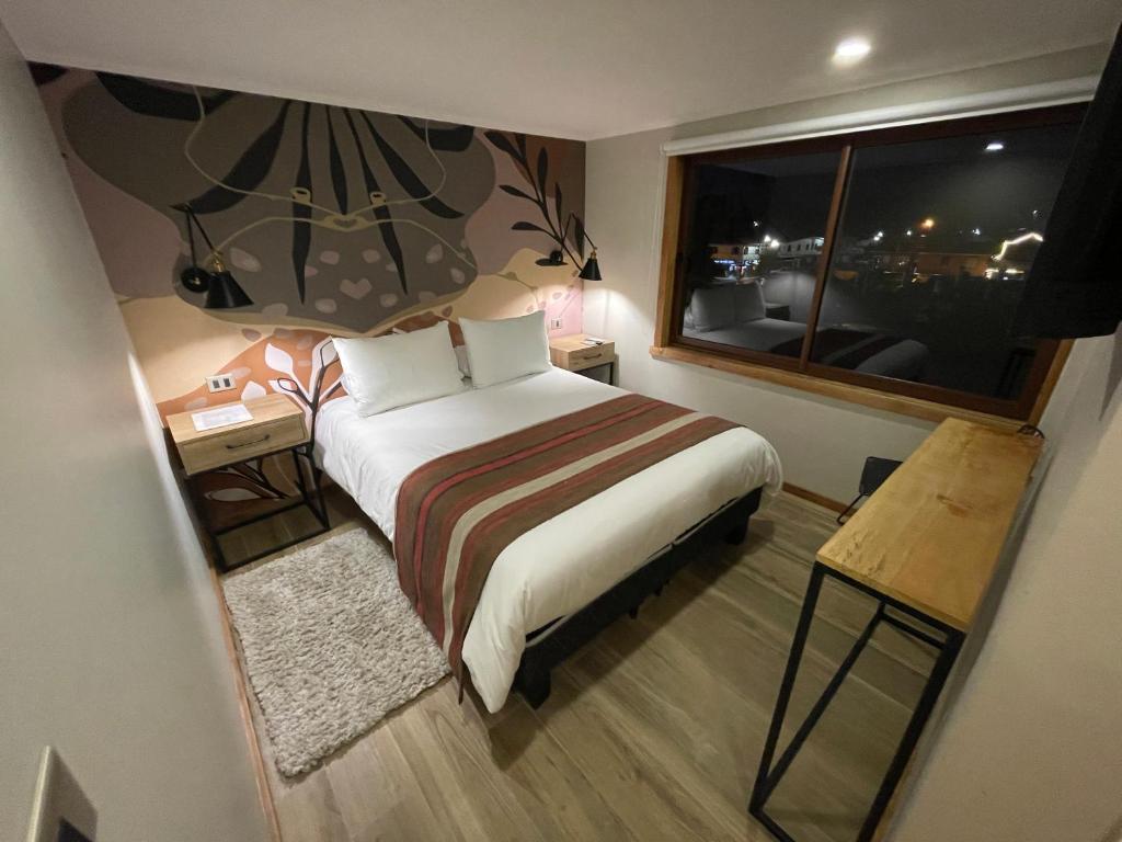 Postel nebo postele na pokoji v ubytování Mawün Hotel Pucón