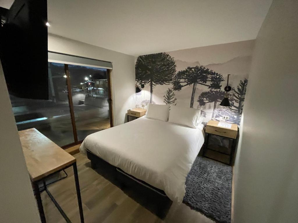 Postel nebo postele na pokoji v ubytování Mawün Hotel Pucón