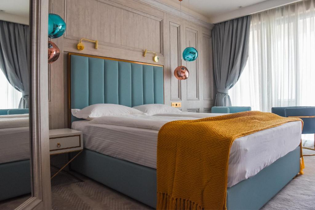 Postel nebo postele na pokoji v ubytování Hotel Maris