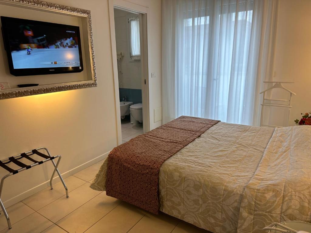 Postel nebo postele na pokoji v ubytování Hotel Albatros