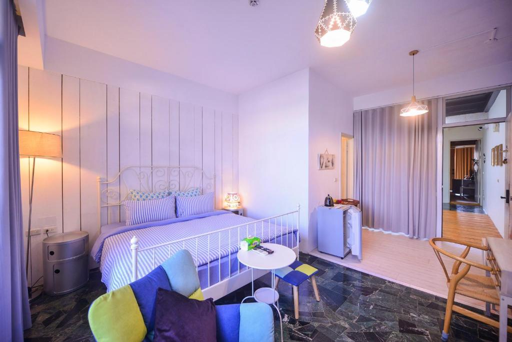 Postel nebo postele na pokoji v ubytování CASA CoMoDo 自在家