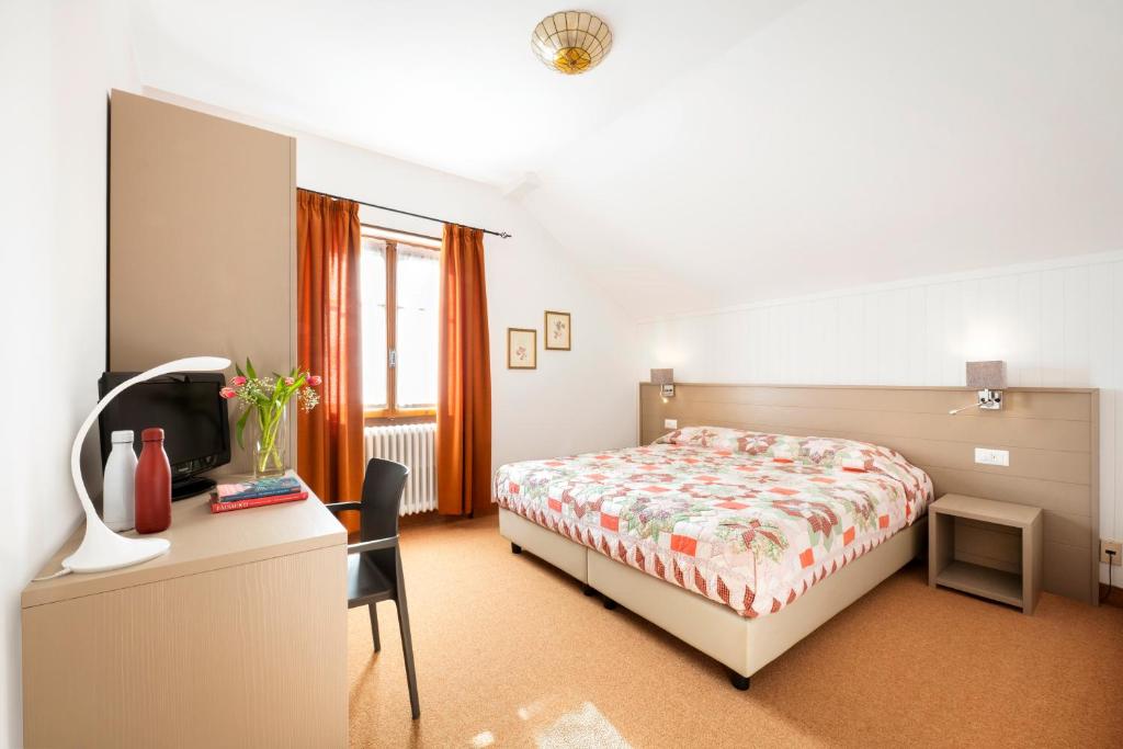 Postel nebo postele na pokoji v ubytování Hotel Ristorante Miramonti