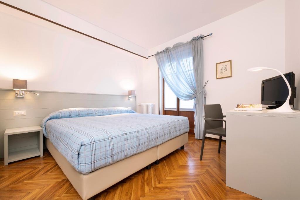 Postel nebo postele na pokoji v ubytování Hotel Ristorante Miramonti