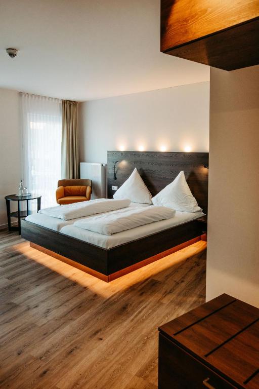 Postel nebo postele na pokoji v ubytování Hotel Bolte
