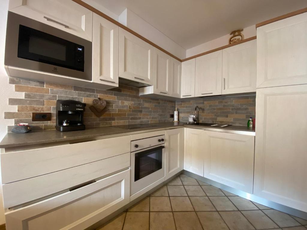 Kuchyň nebo kuchyňský kout v ubytování Residence Lastè