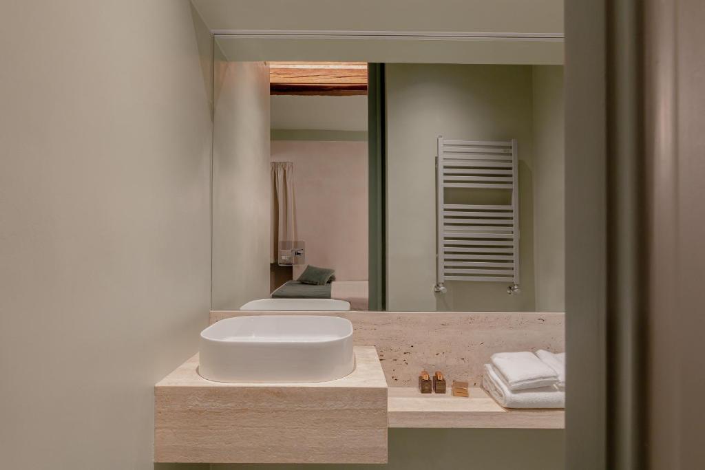A bathroom at Design apartment with private pool in Campo dei Fiori