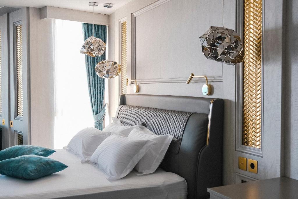 Postel nebo postele na pokoji v ubytování Hotel Maris
