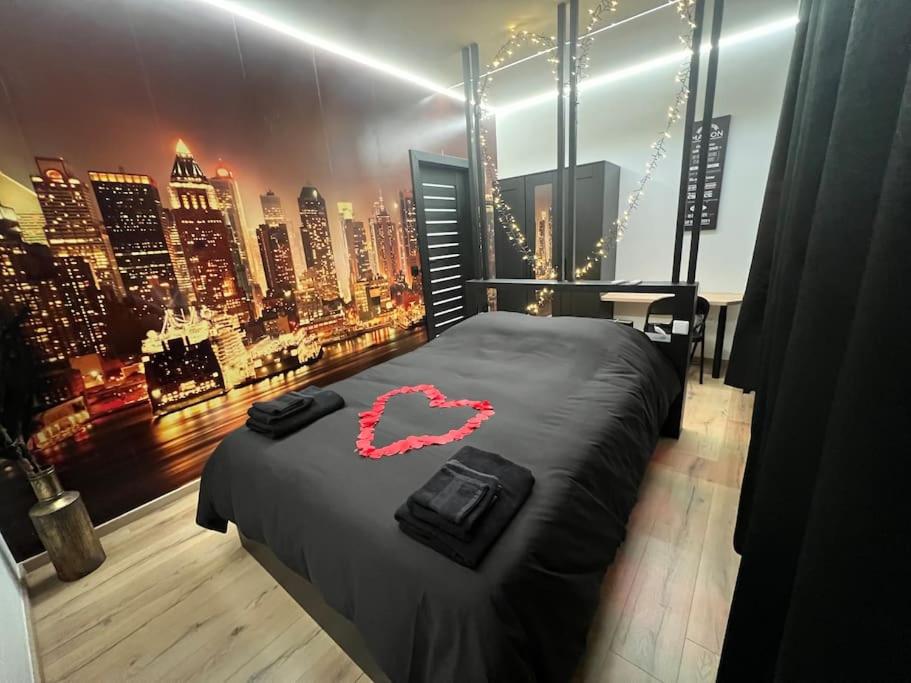 เตียงในห้องที่ Fabuleusement romantique