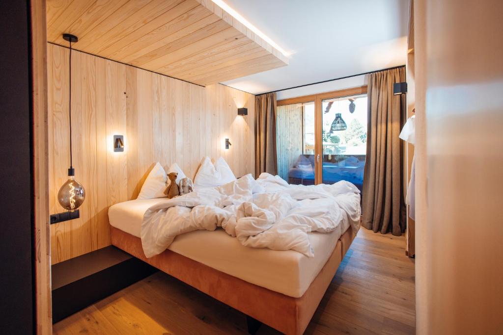 Postel nebo postele na pokoji v ubytování Hotel Gasthof Hirschentenne