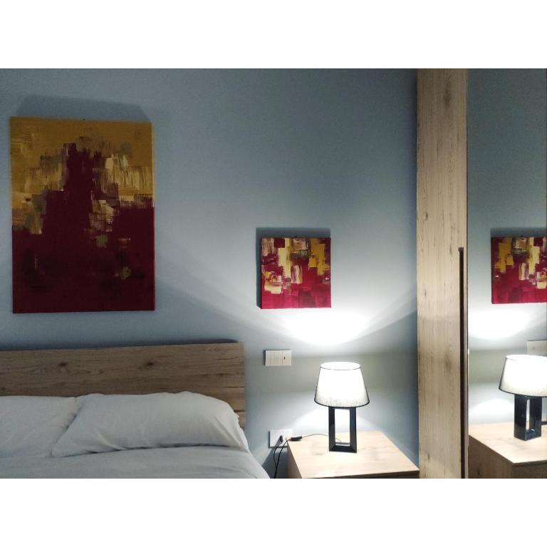 Postel nebo postele na pokoji v ubytování GArt Riviera B&B