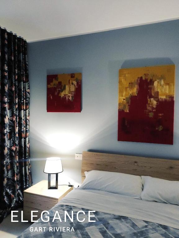 Postel nebo postele na pokoji v ubytování GArt Riviera B&B