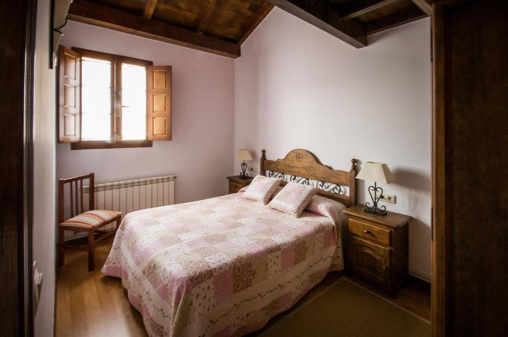 Postel nebo postele na pokoji v ubytování Apartamentos El Sualleiro