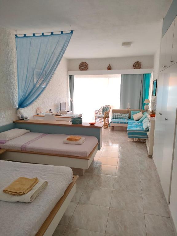 Postel nebo postele na pokoji v ubytování Front Beach Jandía Apartment