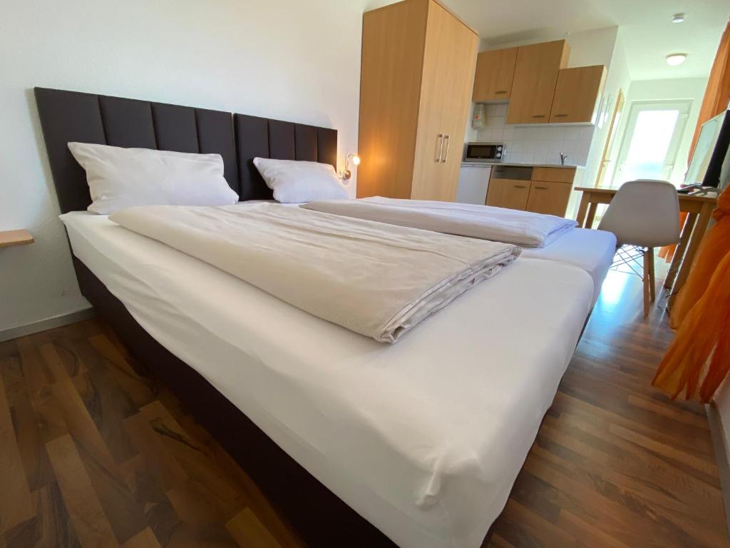Postel nebo postele na pokoji v ubytování Fleiner Gästehaus