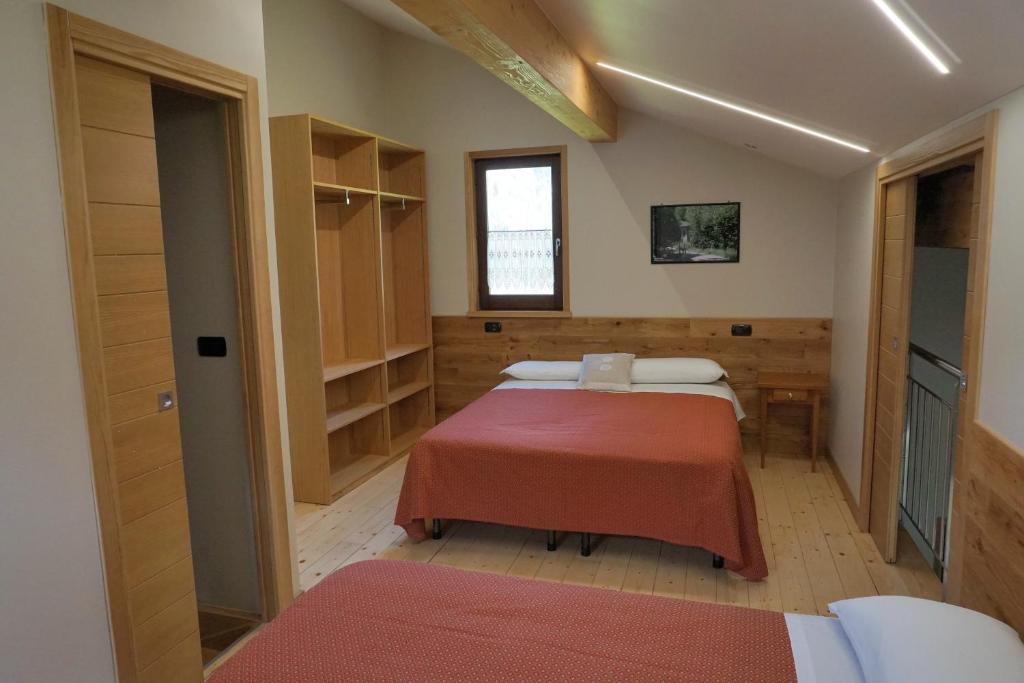 Postel nebo postele na pokoji v ubytování Pensione Albergo Diffuso Ceaglio Valle Maira