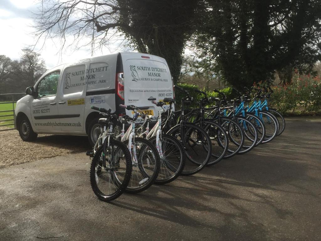 a group of bikes parked next to a van at Glamping at South Lytchett Manor in Poole