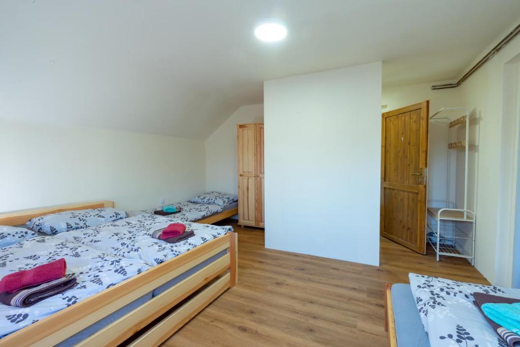Postel nebo postele na pokoji v ubytování Apartmány Petra