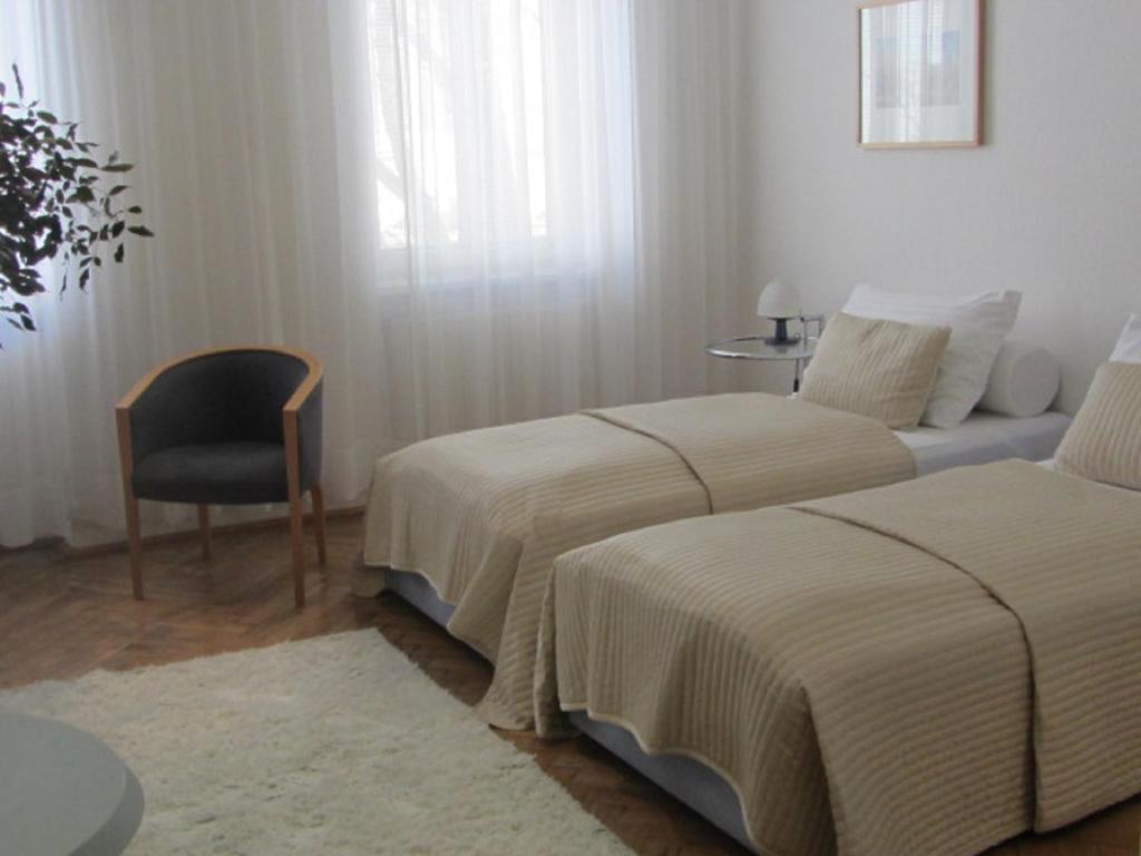 Postel nebo postele na pokoji v ubytování Hotel Wiener Kindl