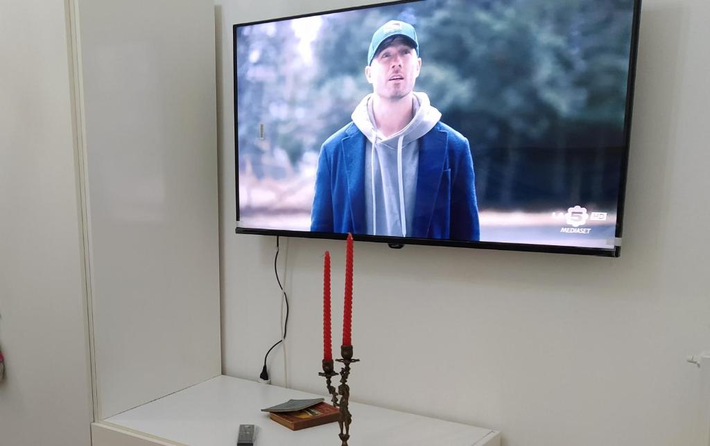 TV a/nebo společenská místnost v ubytování Rosso Quintino